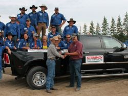 Bull Riding Champion receives the hardware from Steinbach Dodge.