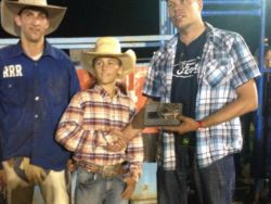 2014 Jr. Bullnanza winner Karson Turel presented with buckle from Fairway Ford.